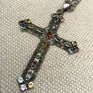 Silver cross with semi-precious stones.